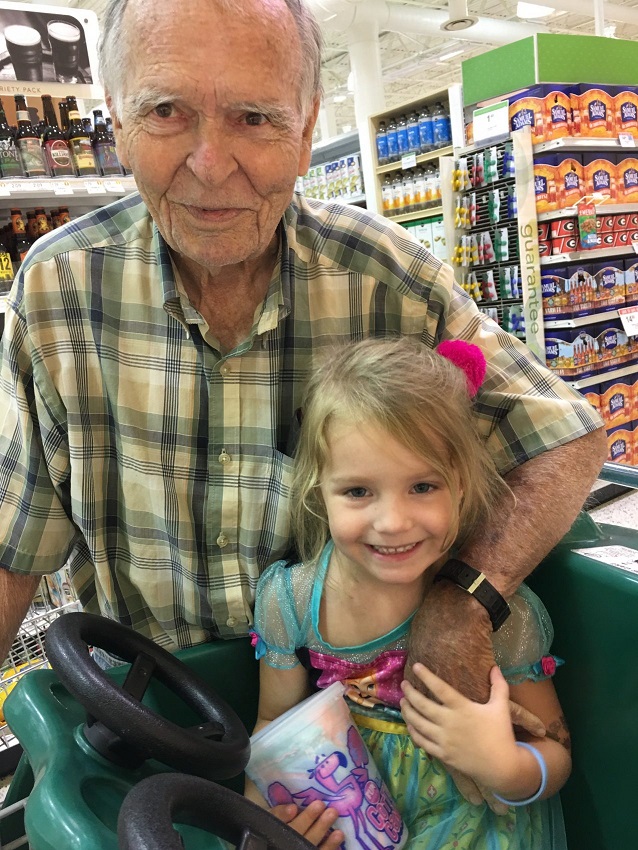Norah and Dan holding hands at the grocery