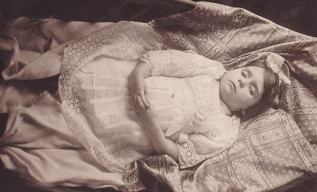 Post mortem of a young girl lying on a blanket