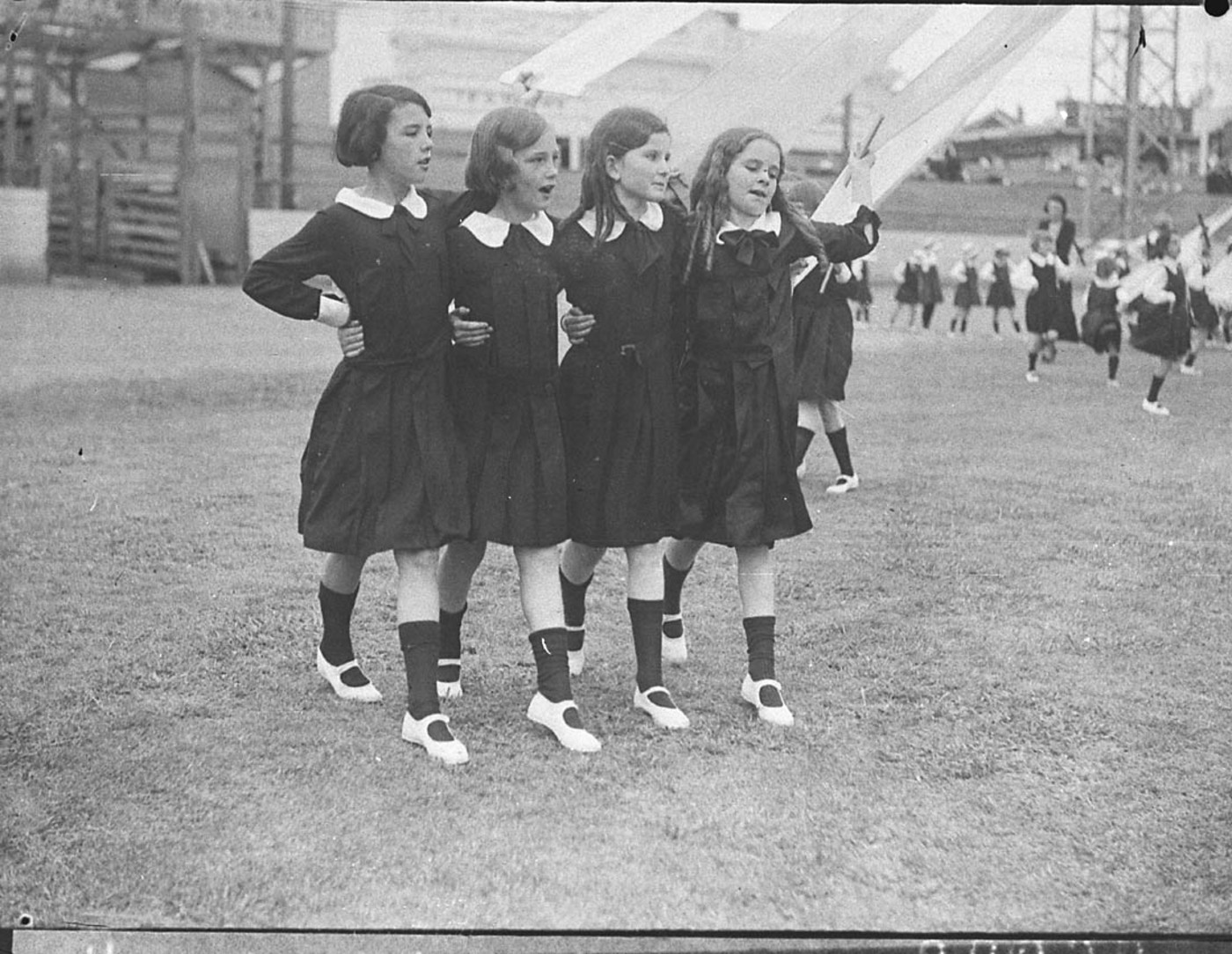 Sam Hood - Group of four young schoolgirls singing as they dance round the maypole