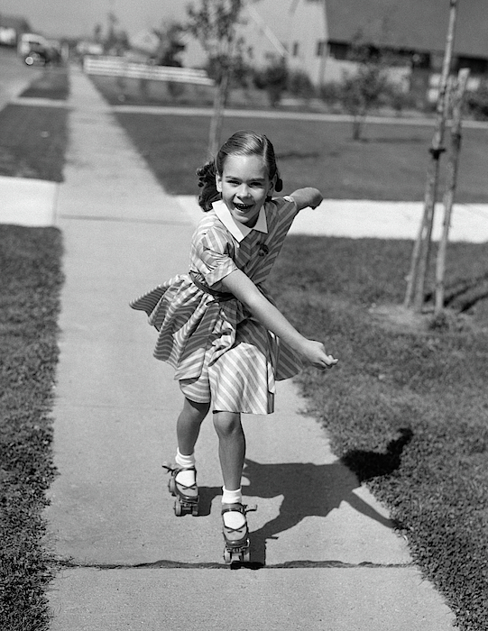 Vintage Images - 1950s Little girl roller-skating