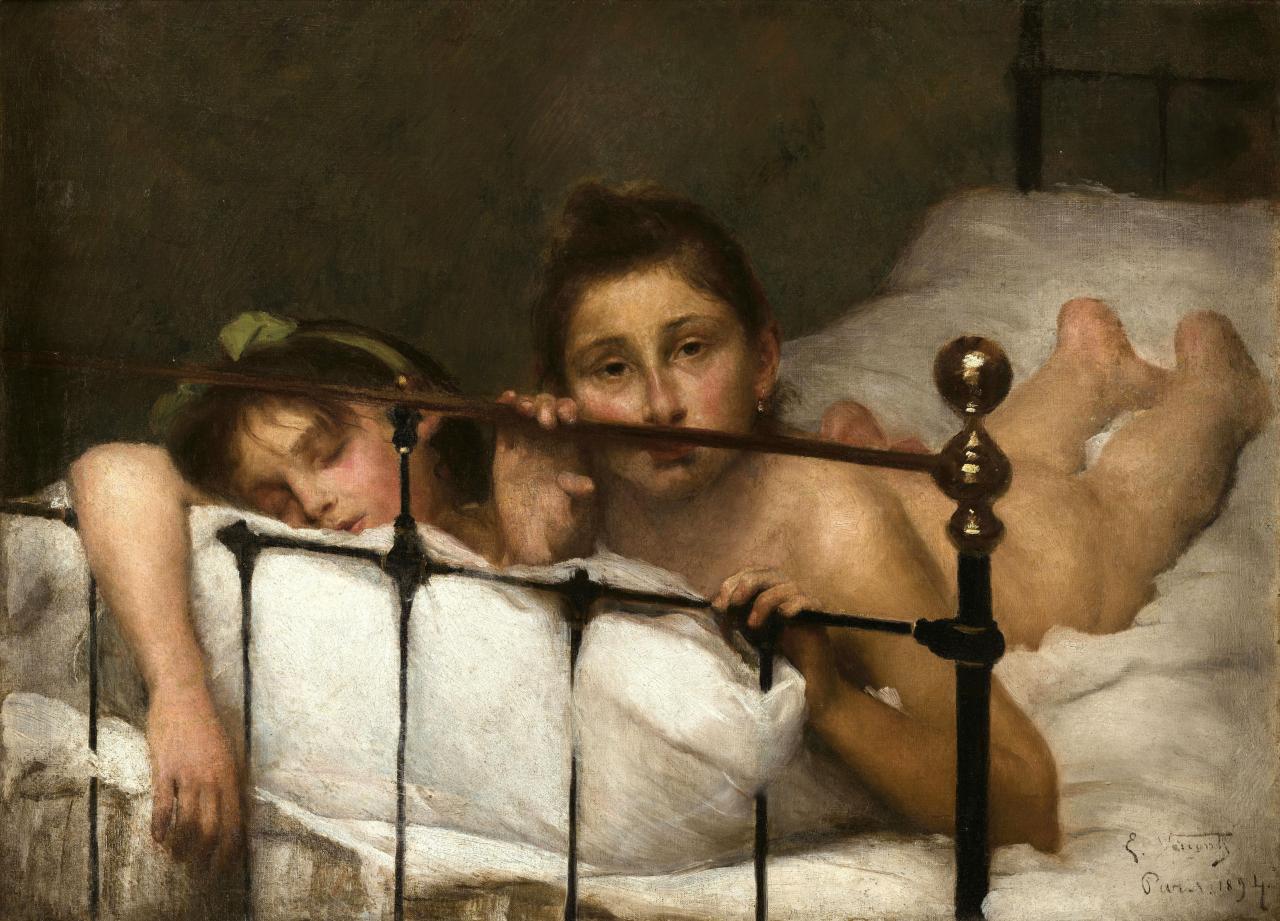 two nude girls on a bed